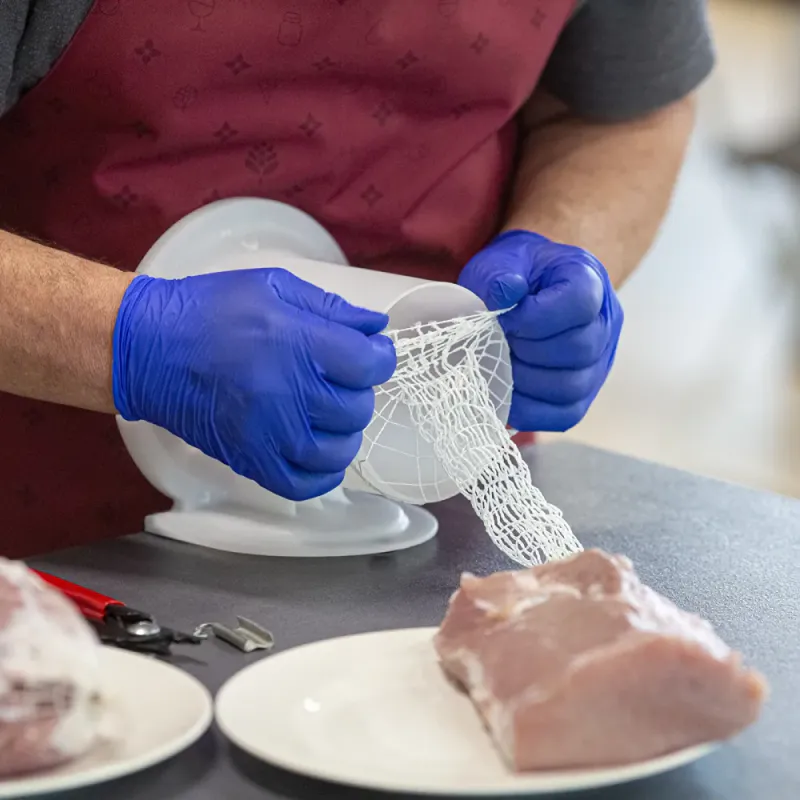 Meat netting applicator for ham and cheese 